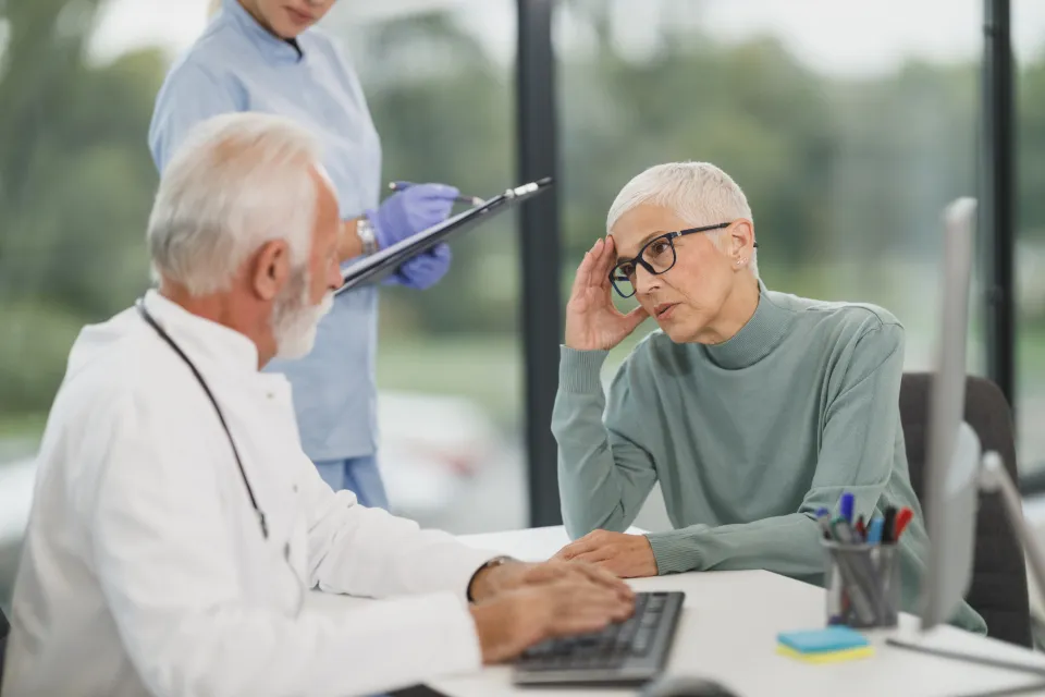 A patient with an English-speaking companion at a modern clinic in China
